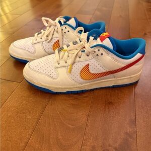 Nike White and Blue Athletic Shoes with Orange Accents